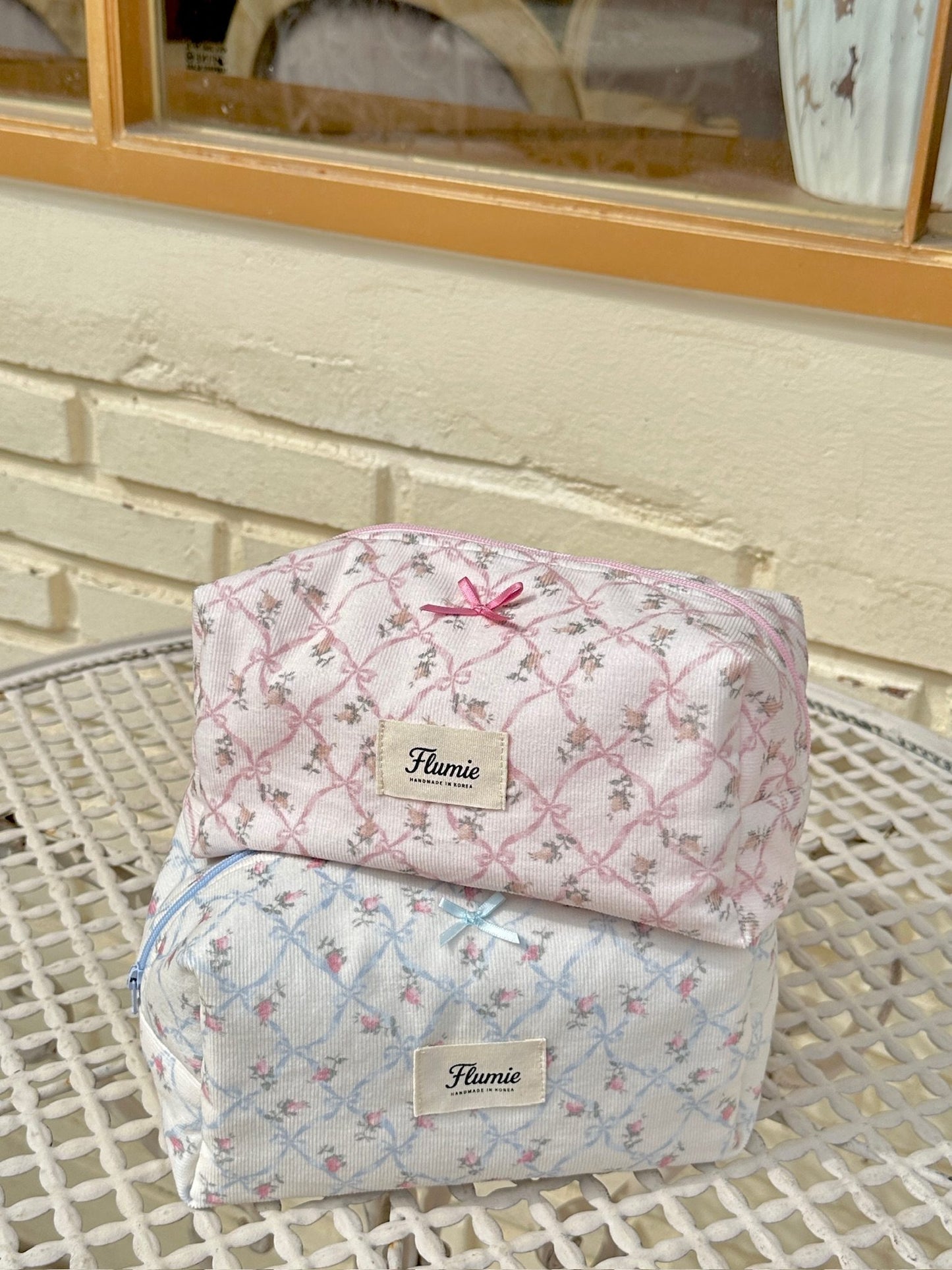 The soft texture of the pouch glows under sunlight, capturing warm cottagecore vibes