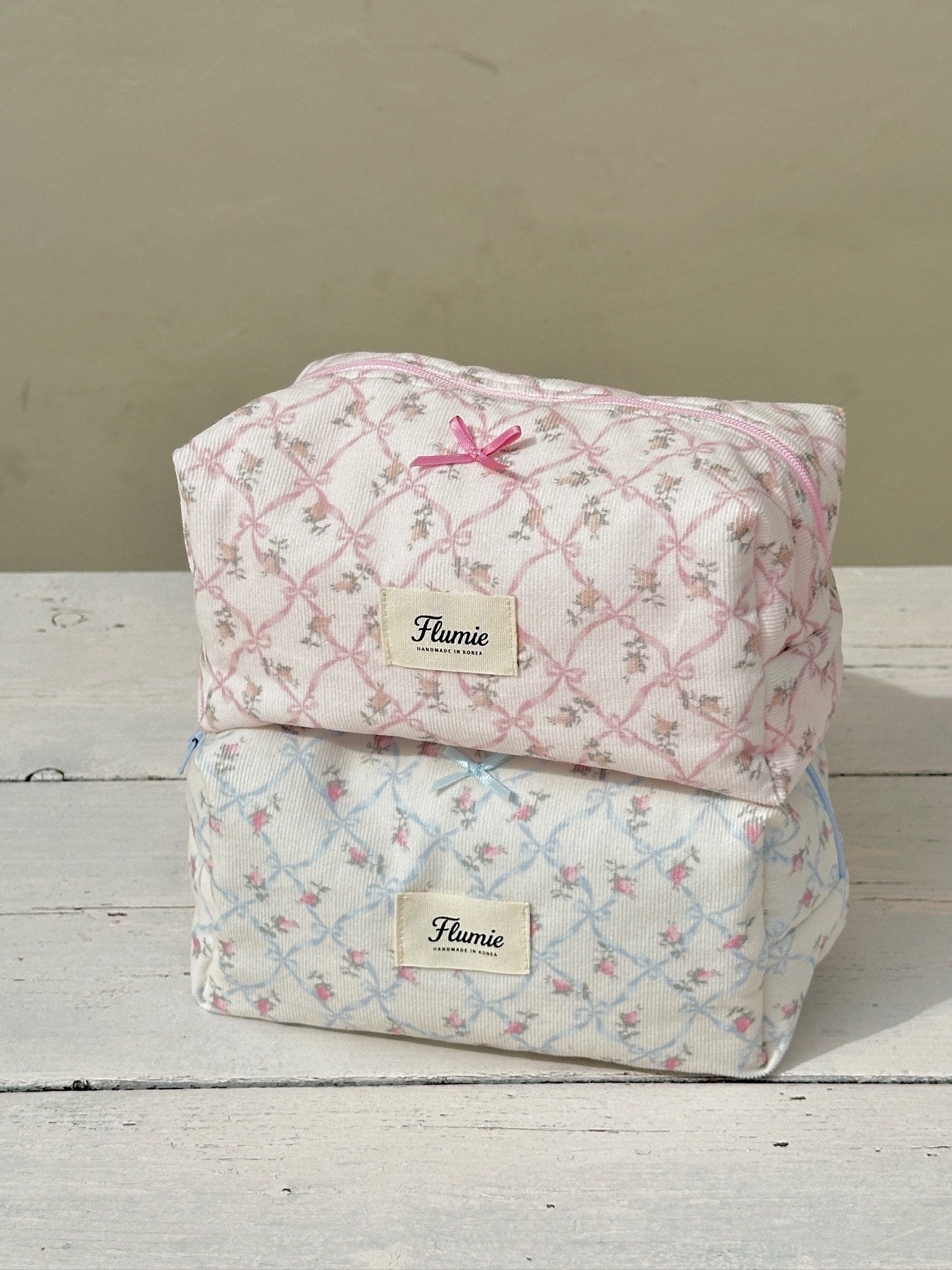 The soft texture of the pouch glows under sunlight, capturing warm cottagecore vibes