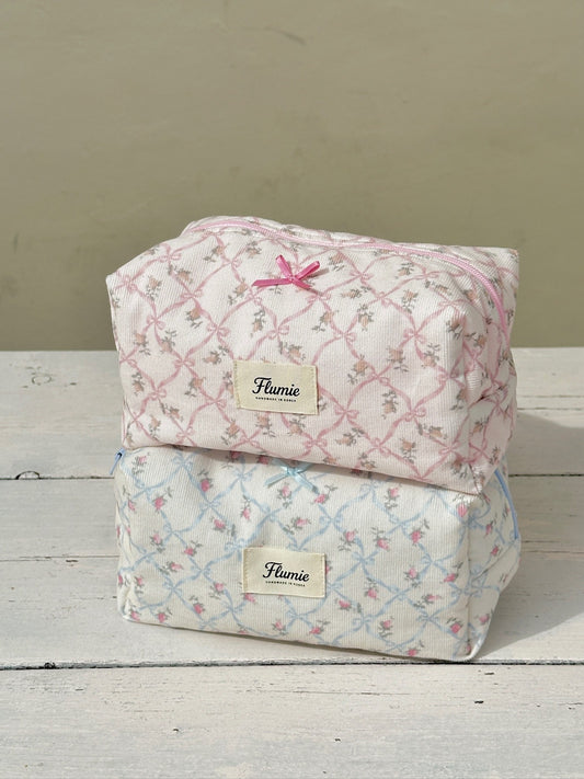 The soft texture of the pouch glows under sunlight, capturing warm cottagecore vibes