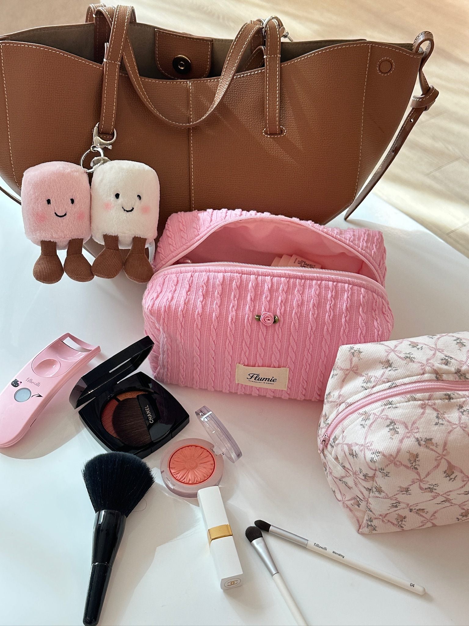 Rose accent on the cable knit texture adds a classic feminine point