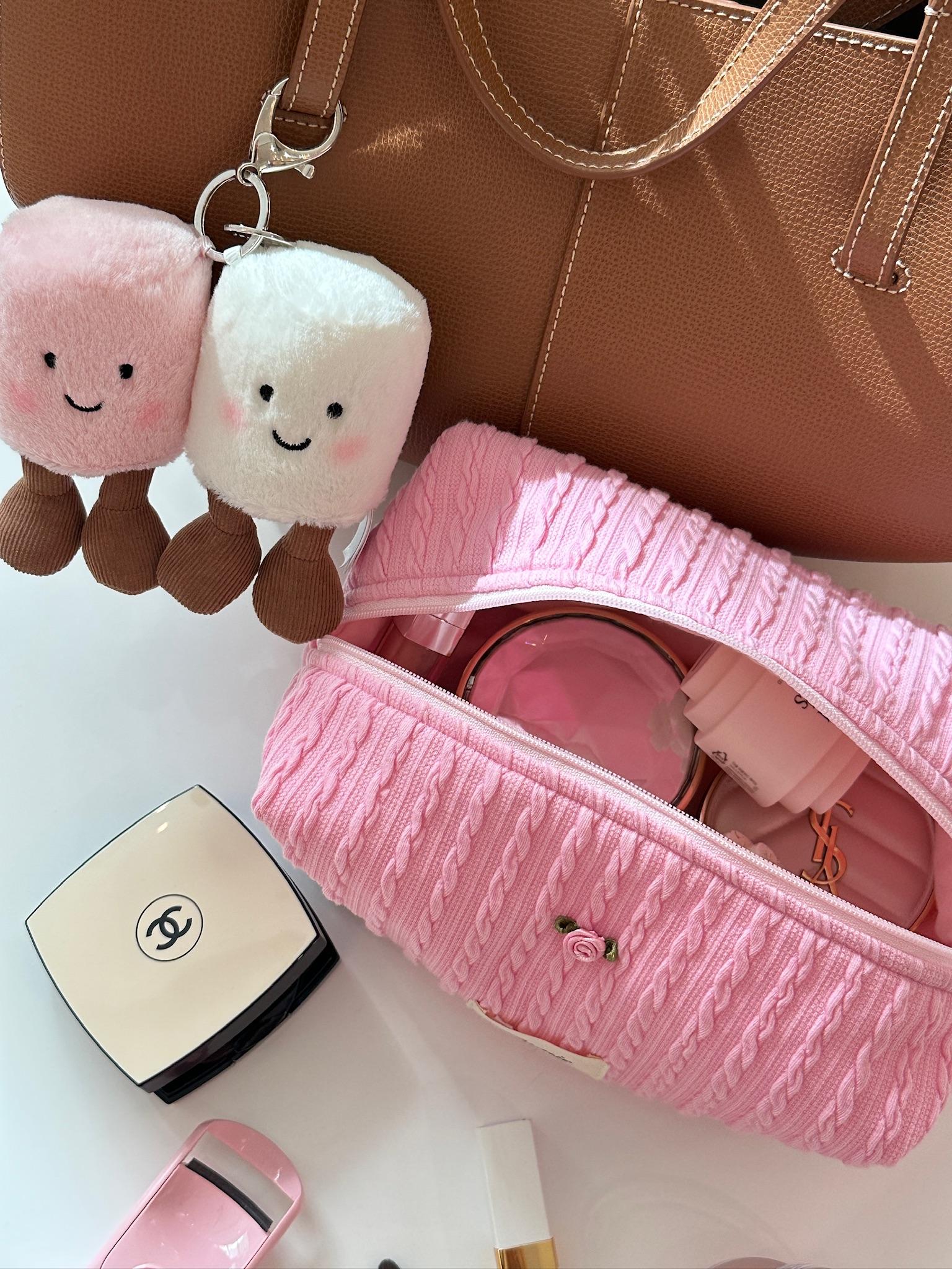 Strawberry Milk pouch paired with a leather tote for a casual chic look